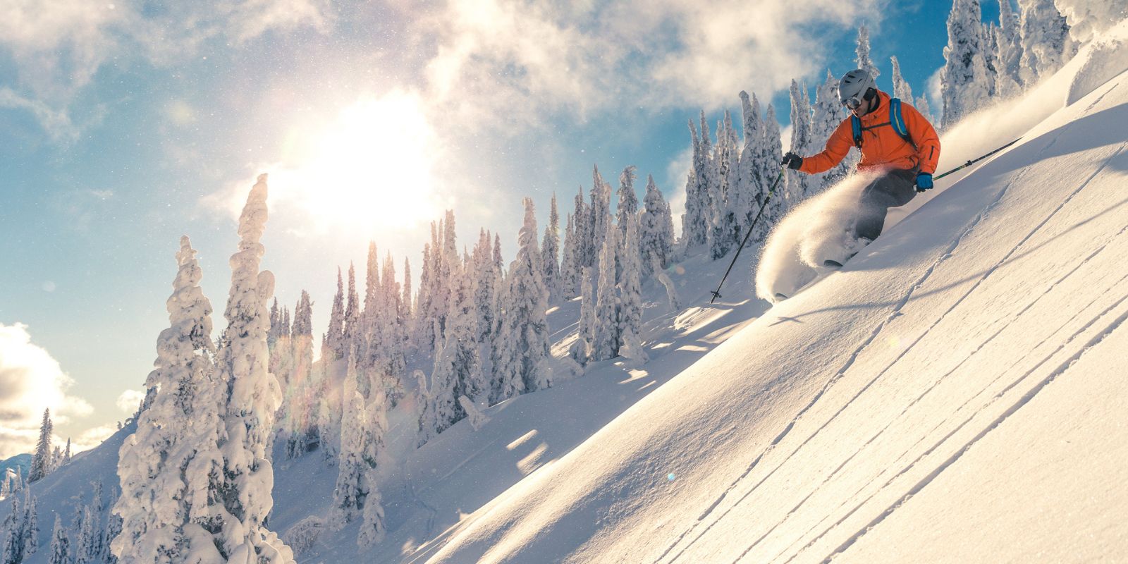 A person skiing downhill. Compression pants, compression leggings, compression tights, knee support for skiing, skiing knee pain, knee pain skiing, knee brace skiing, skiing knee brace, knee braces in calgary, knee brace stores near me
